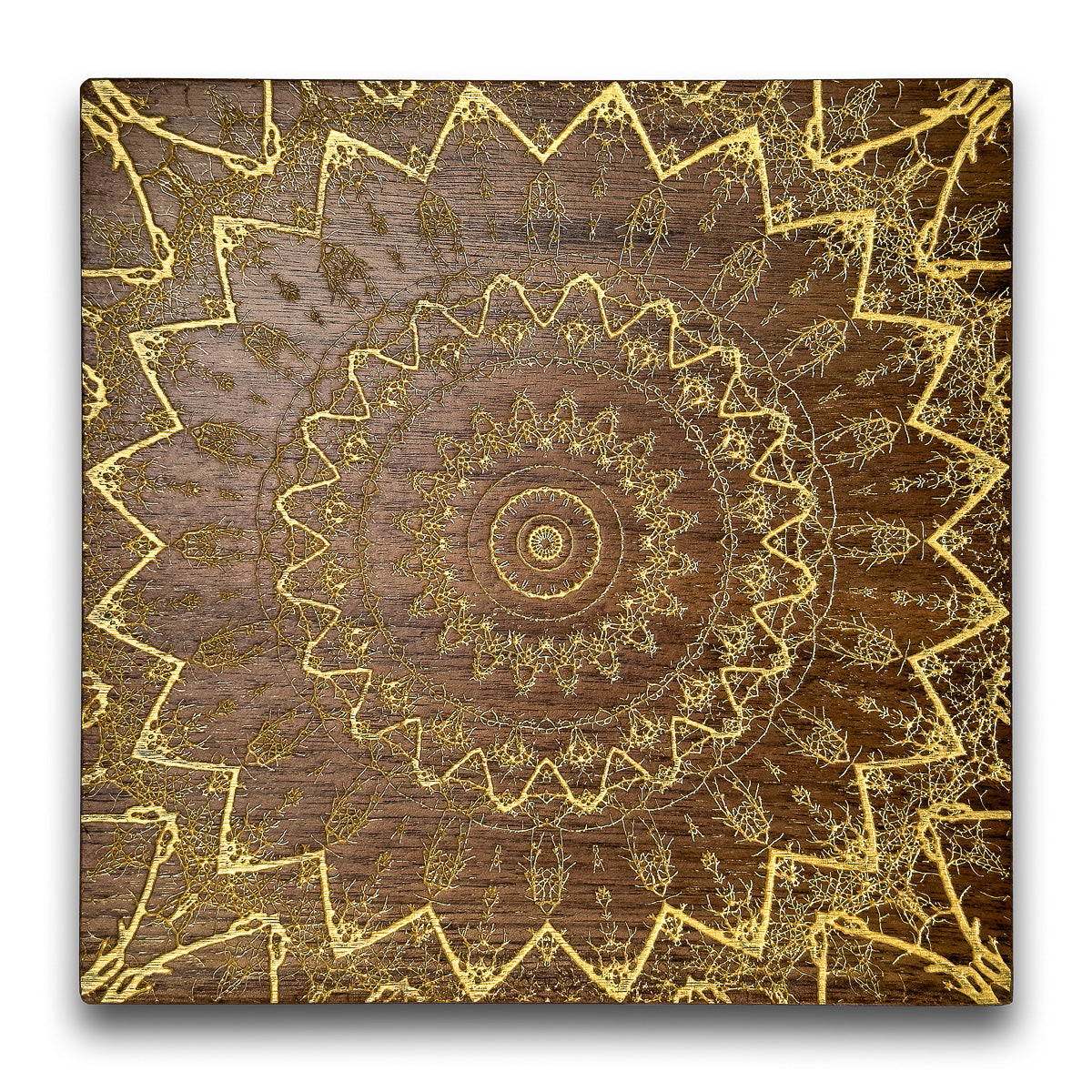 Laser engraved walnut kaleidoscope/mandala relief filled with gold acrylics